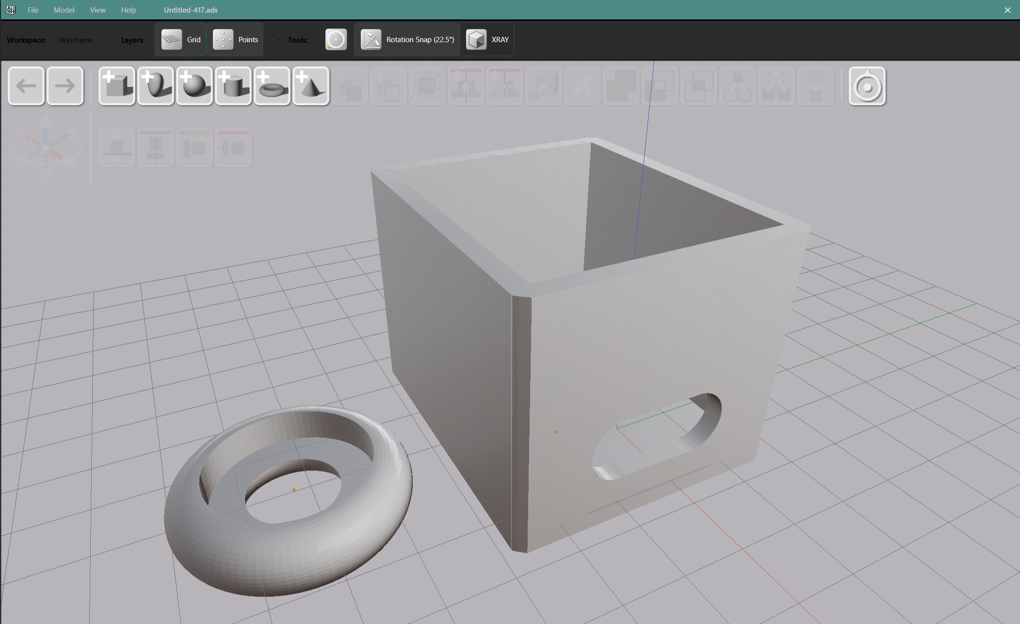 AdaShape UI with gray toolbar, box and torus on canvas